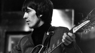 George Harrison of English rock and pop group The Beatles plays his 1963 Rickenbacker 360/12 guitar on stage during rehearsals for the ABC Television music television show 'Thank Your Lucky Stars' Summer Spin at Teddington Studios in London on 11th July 1964. The band would go on to play four songs on the show, A Hard Day's Night, Long Tall Sally, Things We Said Today and You Can't Do That. 