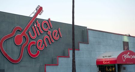 A landscape shot of the iconic Guitar Center logo and shop entrance to its Sunset Boulevard store.
