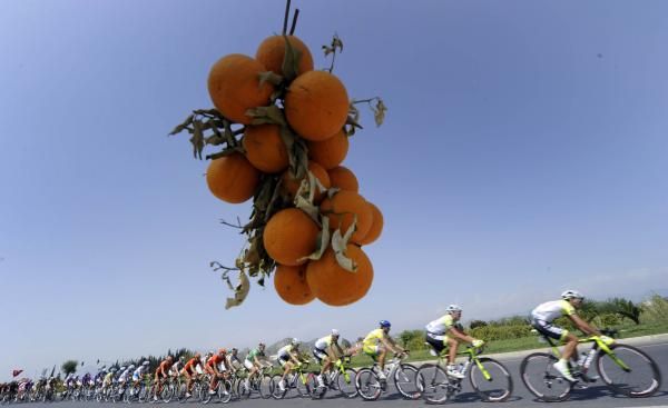 A few oranges are dangled at the riders