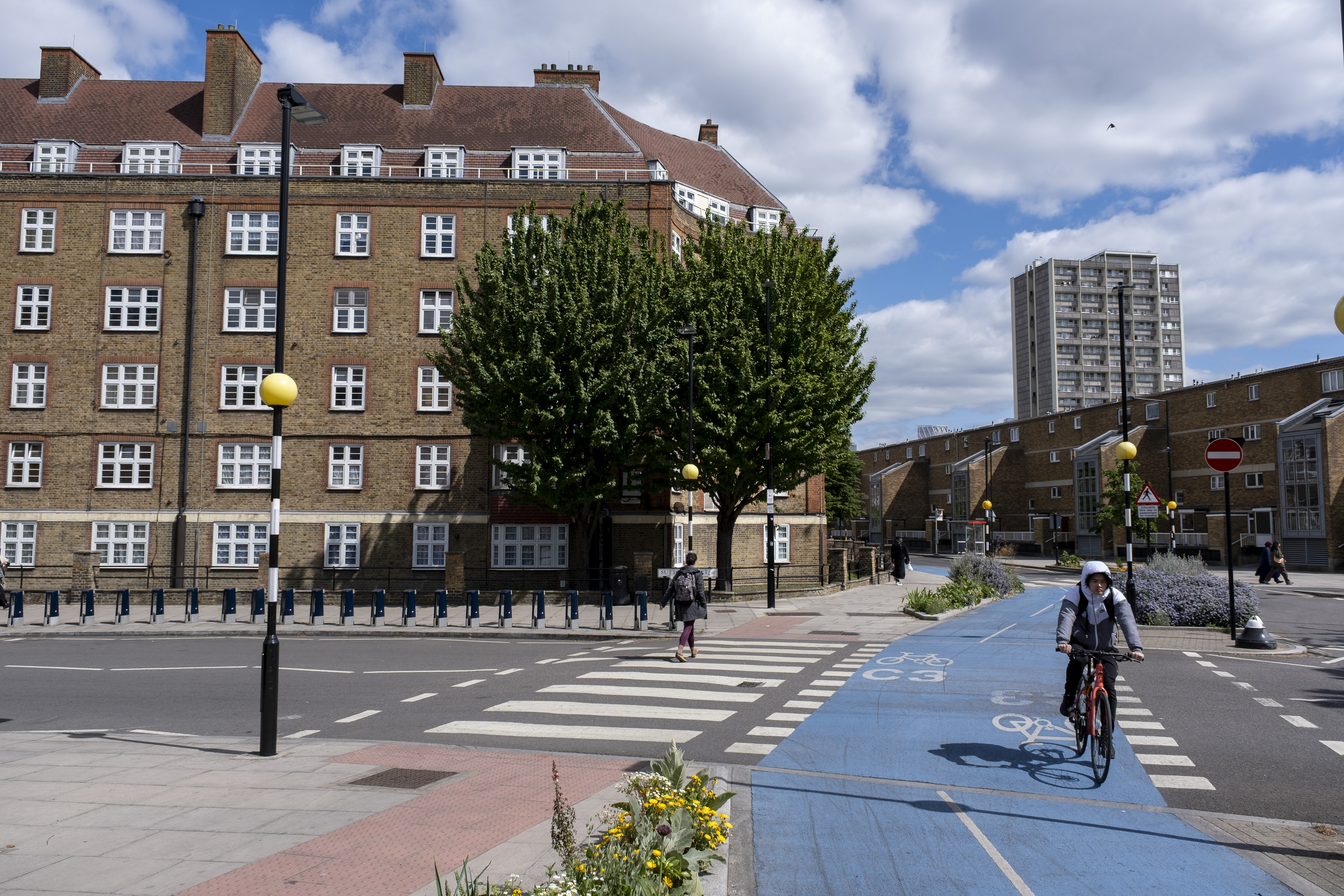 Someone cycles on a bike path in London