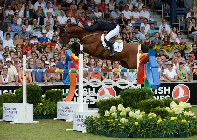 Joe Clee and Utamaro D'Ecaussines jump the individual final at the European Showjumping Championships 2015. Picture by Peter Nixon