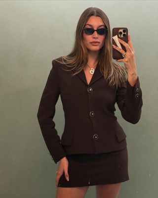 Hailey Bieber wears a chocolate brown suit in her Instagram post