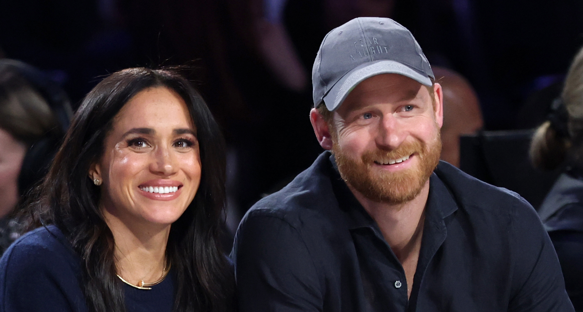 Meghan Markle linking arms with Prince Harry
