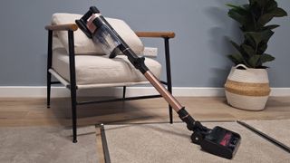 Shark Stratos IZ400 cordless vacuum in testing studio with floor samples