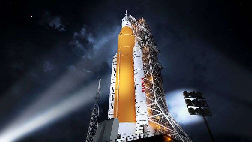 An illustration of NASA's Space Launch System (SLS) rocket lit up at night in its Block 1 crew vehicle configuration.