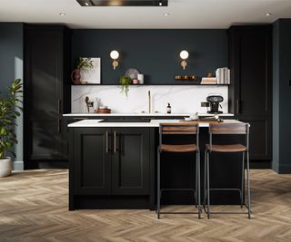 black painted kitchen cabinets and island unit with white splashback