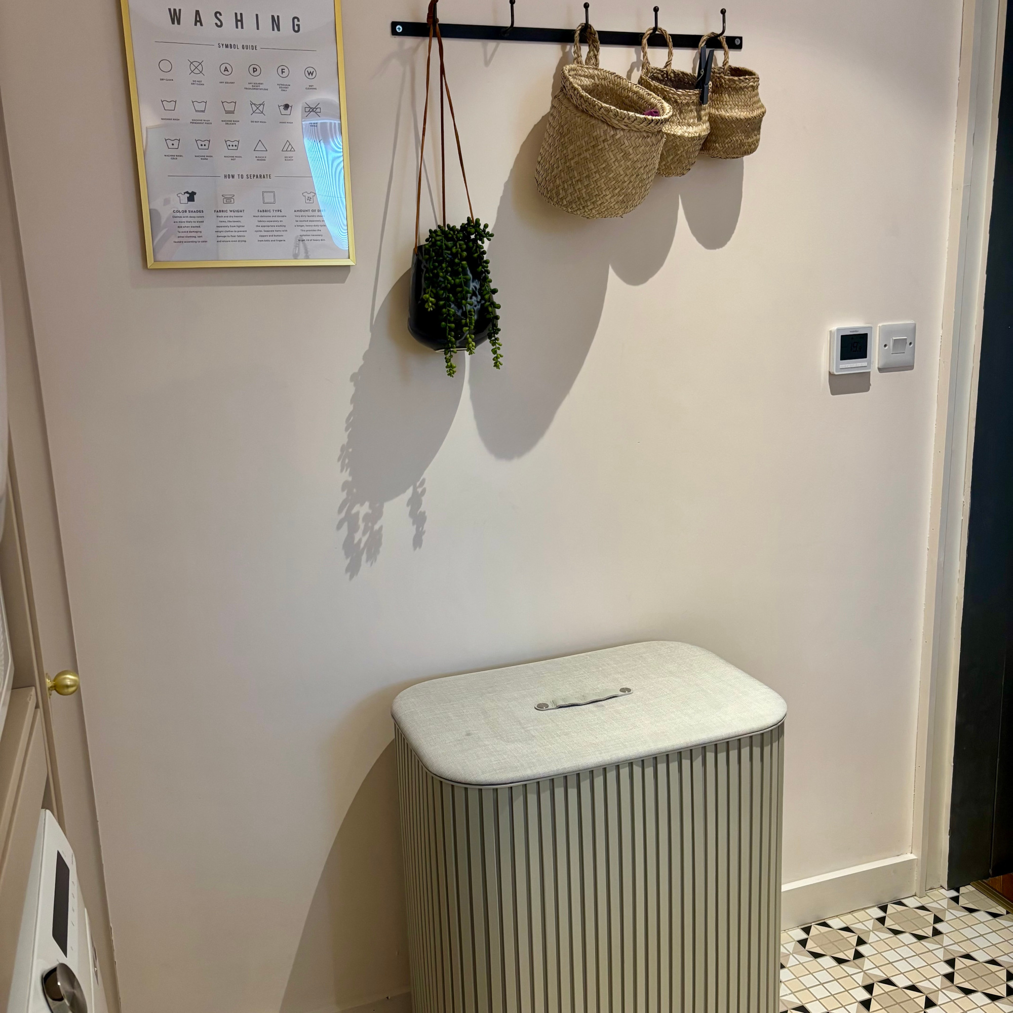 utility room with a joseph joseph trio laundry basket