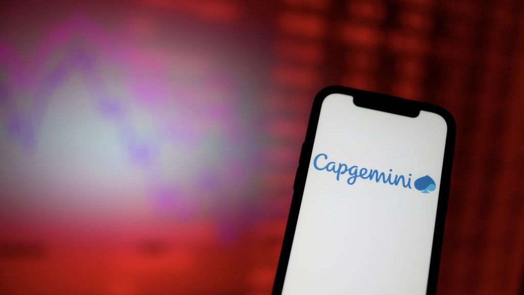 The CapGemini logo on smartphone screen with stocks and shares background