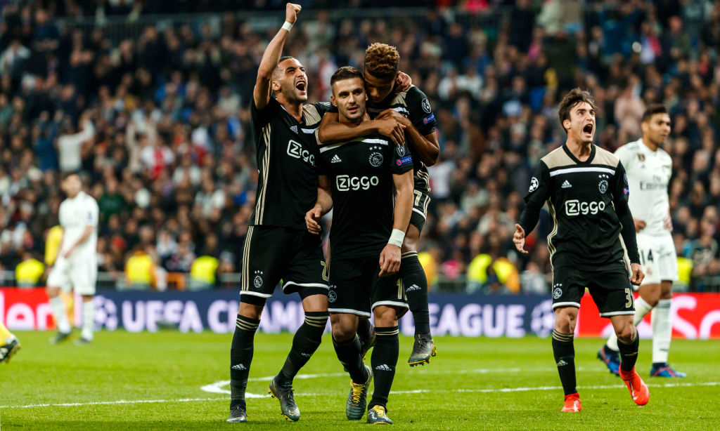 Dusan Tadic of Ajax celebrates his goal with team mates during the UEFA Champions League Round of 16 Second Leg match between Real Madrid and Ajax at Santiago Bernabeu on March 5, 2019 in Madrid, Spain.