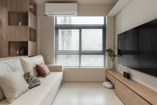 Modern, stylish and bright room with air conditioner place above window