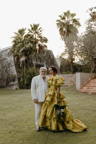 Alexis Johnson in a yellow ruffle Christopher John Rogers custom wedding dress.