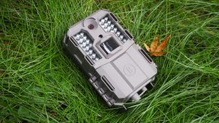 Bushnell Prime L20 trail camera sitting on grass