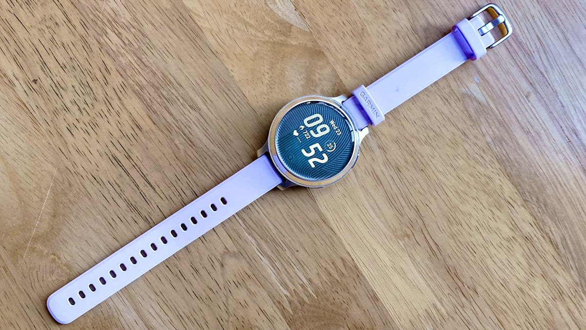 The Garmin Lily 2 Active in lilac on a wood table