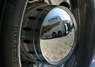 NASCAR's Mobile Technology Center, from the point of view of the NBC truck's hubcap.