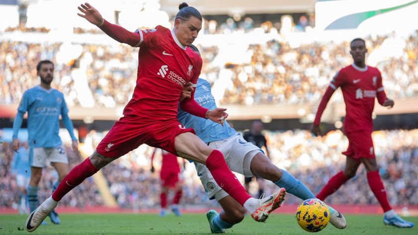 Darwin Nunez of Liverpool and Nathan Ake of Manchester City in action during the Premier League match between Manchester City and Liverpool FC at Etihad Stadium on November 25, 