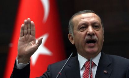 Turkish Prime Minister Recep Tayyip Erdogan said Tuesday that any military forces approaching the Turkish border from Syria would be considered a threat.