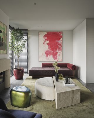 gray living room with green and red furniture