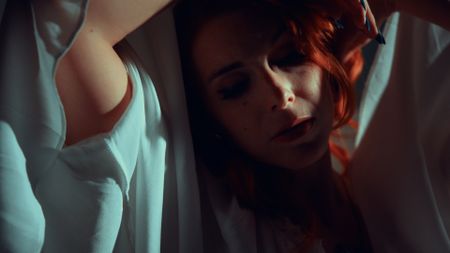 Marianna is cloaked in white in The Infectious Madness of Doctor Dekker 2