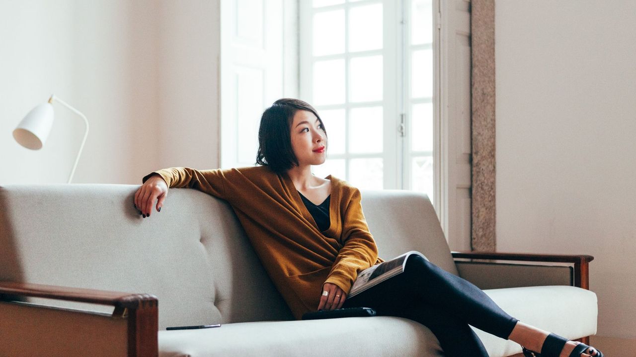 Woman sitting on sofa