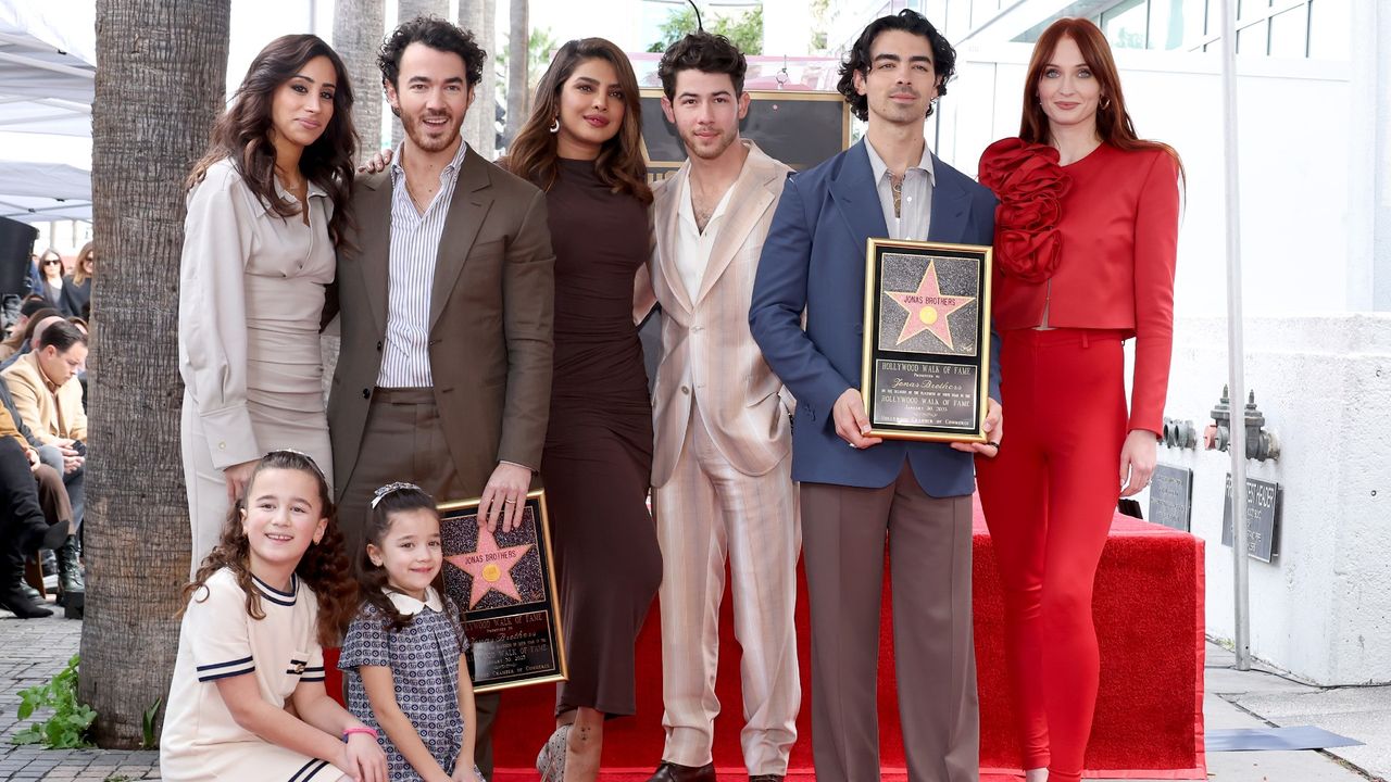  Danielle Jonas, Kevin Jonas, Priyanka Chopra, Nick Jonas, Joe Jonas, Sophie Turner, and (front) Alena Rose Jonas and Valentina Angelina Jonas attend The Hollywood Walk of Fame star ceremony honoring The Jonas Brothers on January 30, 2023 in Hollywood, California.