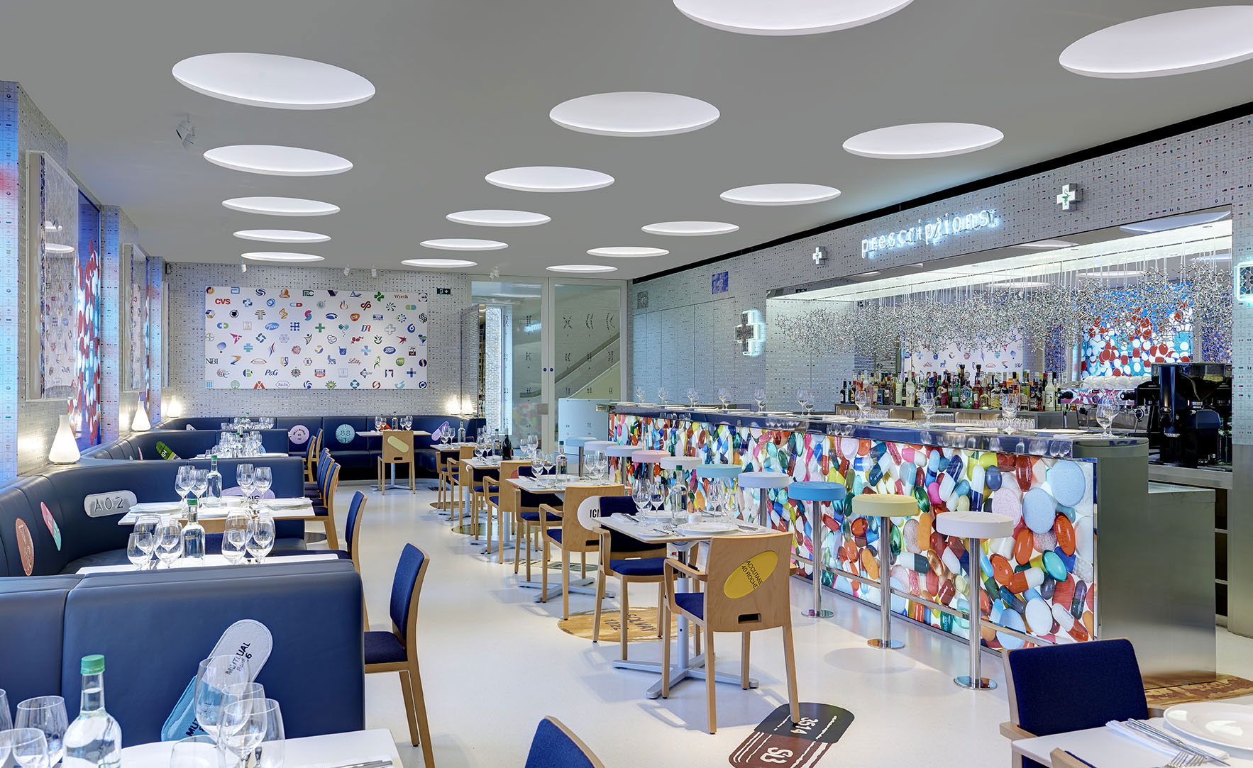 Bar stools are topped with giant squishy paracetamol pills