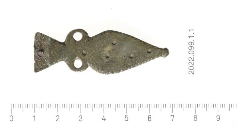 Part of a Roman military belt, found near the watchtower, is seen here. It is approximately 6cm long and about 2cm wide. It is shaped like an arrowhead.