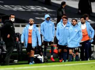 Manchester City’s Sergio Aguero, left, remained on the bench for the 2-0 defeat at Tottenham