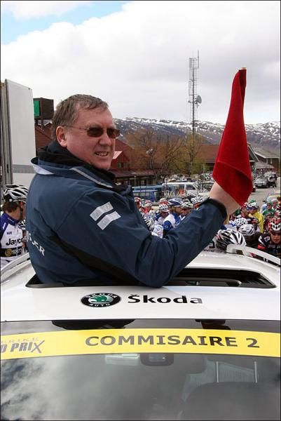 The peloton won't start racing until the race commisaire gives them the okay.