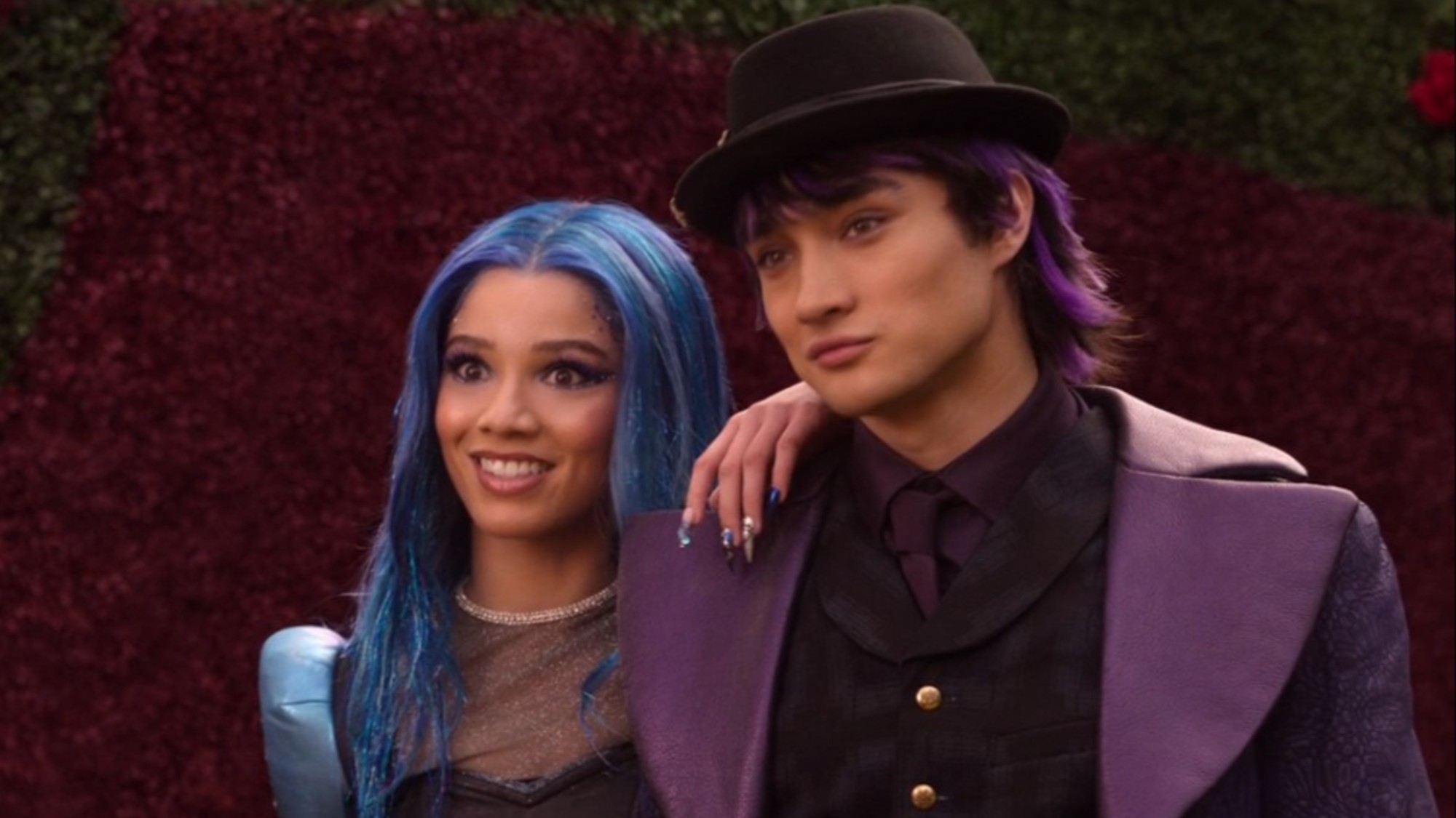 Malia Baker and Brendon Tremblay looking at the camera in Descendants: Wicked Wonderland.