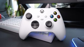 The Xbox Wireless Controller in white sat on a desk.