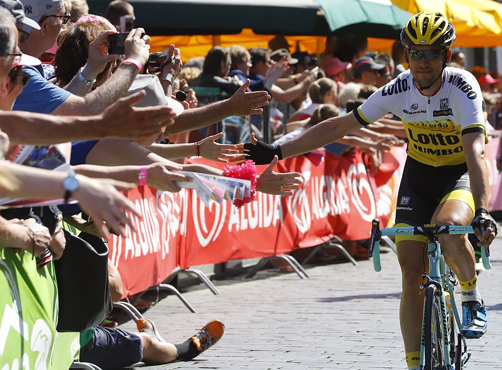 Martijn Keizer shakes hands with supporters before the start of the third stage of the Giro d'Italia, in Nijmegen