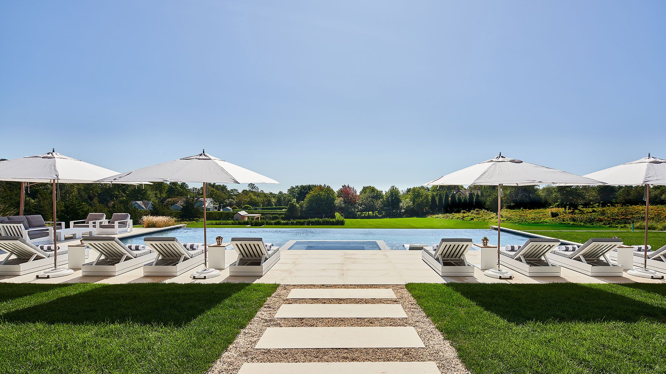 Swimming pool with sun loungers