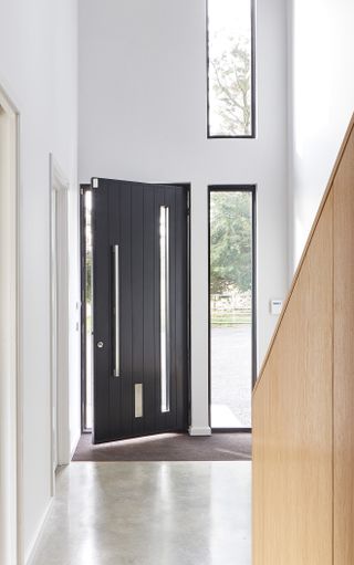 black front door with separate glazed panel