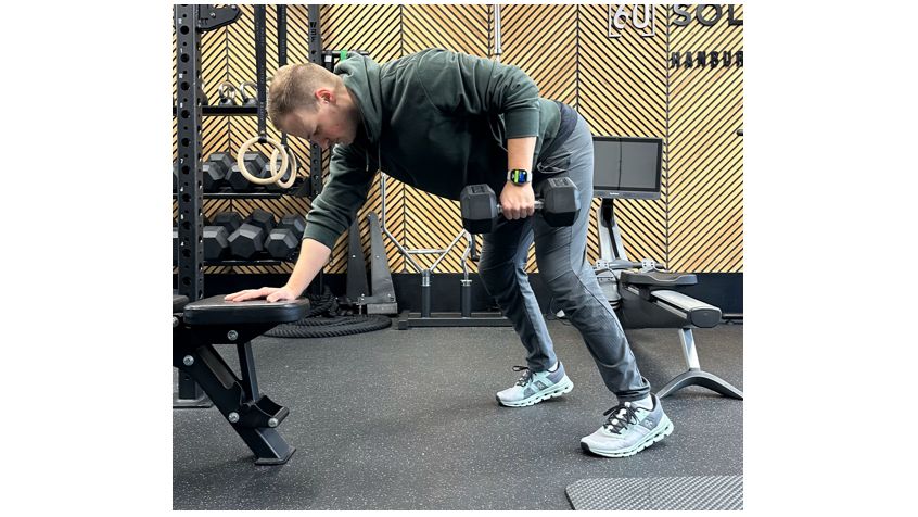 Ollie Thompson performing a single-arm 3-point dumbbell row