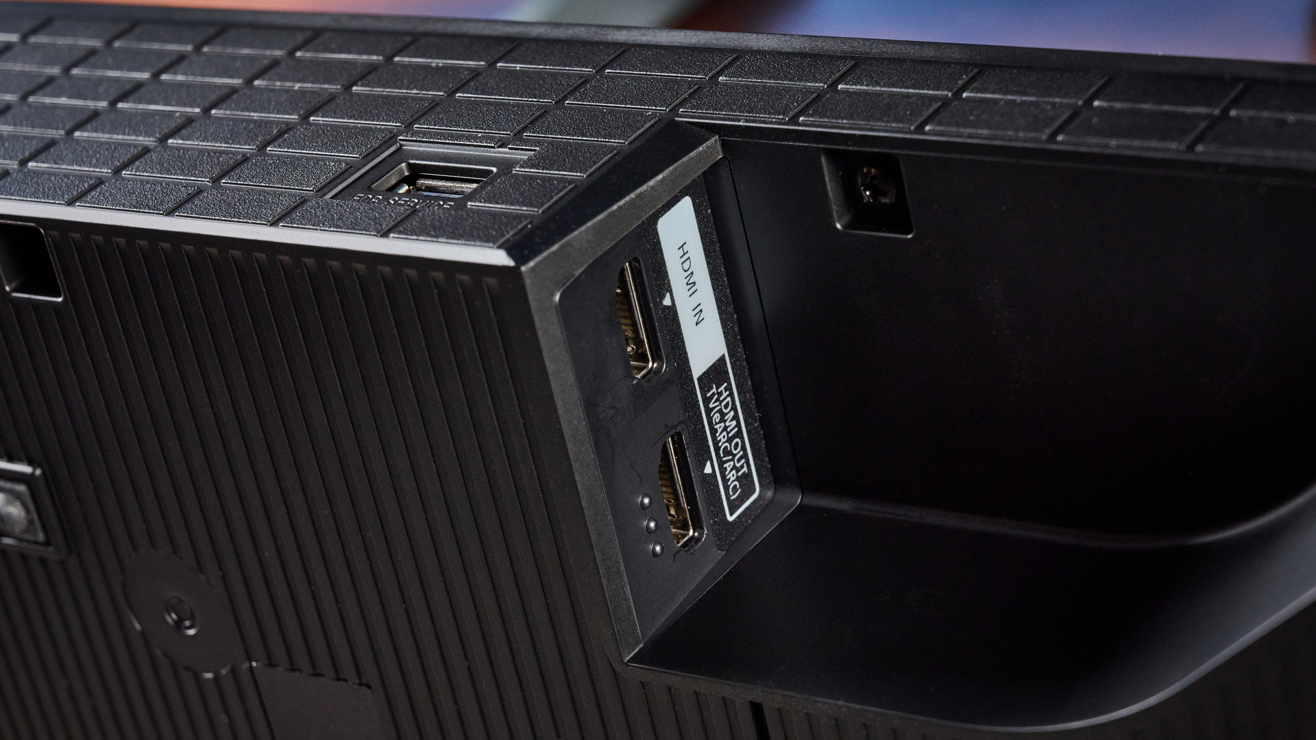 the sony bravia theater bar 7 photographed with the subwoofer with a TV on the tom's guide blue background