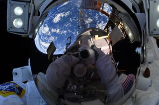 In this out-of-this-world selfie, NASA astronaut Mike Hopkins held his camera out and snapped a photo of himself during a spacewalk with fellow NASA astronaut Victor Glover on Feb. 1. "Ever wonder what an astronaut sees when out on a spacewalk? This selfie shows my view reflecting off of my visor. Takes your breath away!" Hopkins wrote on Twitter, where he shared the space selfie.