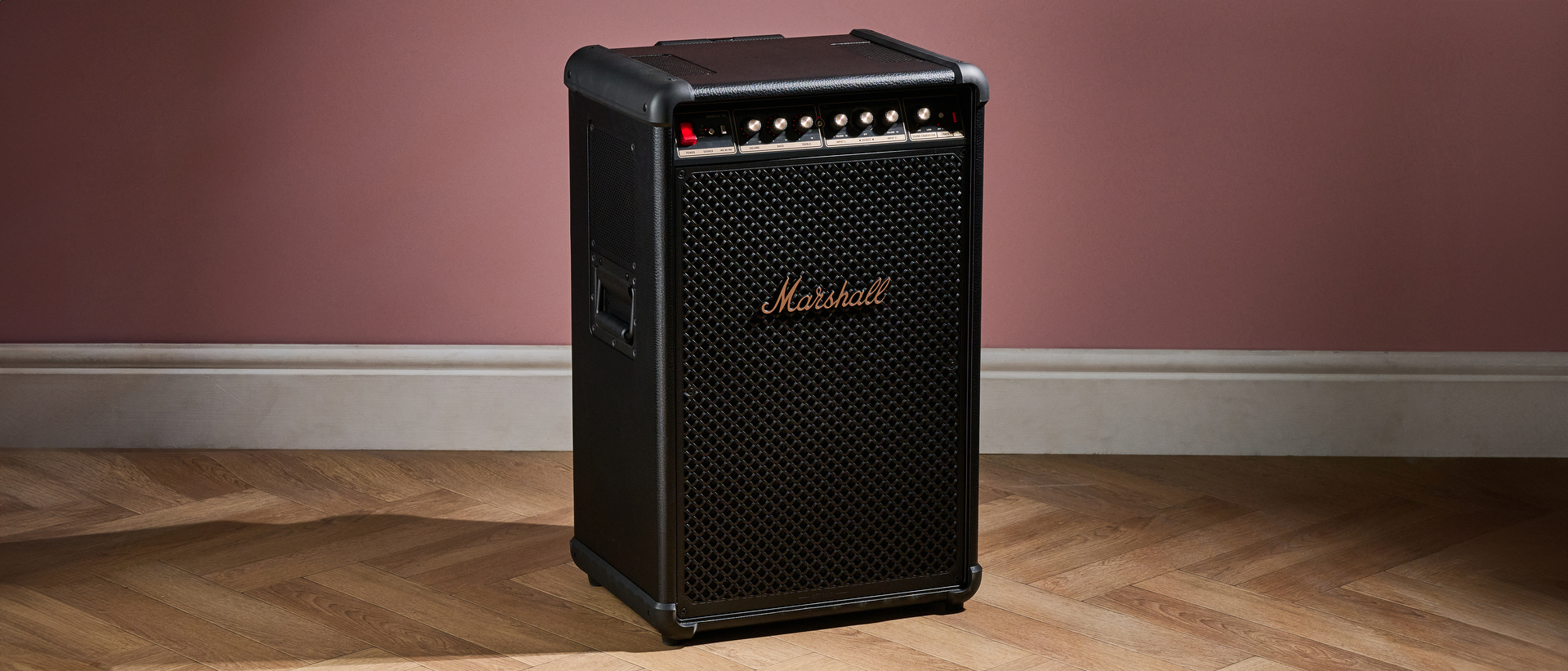 Marshall Bromley 750 on the floor against pink background