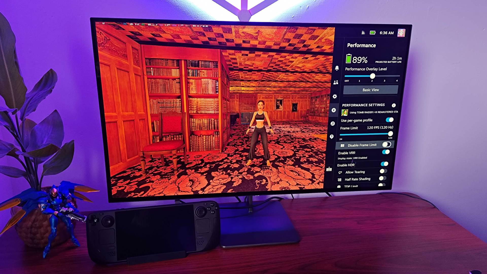 Steam Deck hooked up to BenQ Steam Deck dock with Tomb Raider gameplay on screen