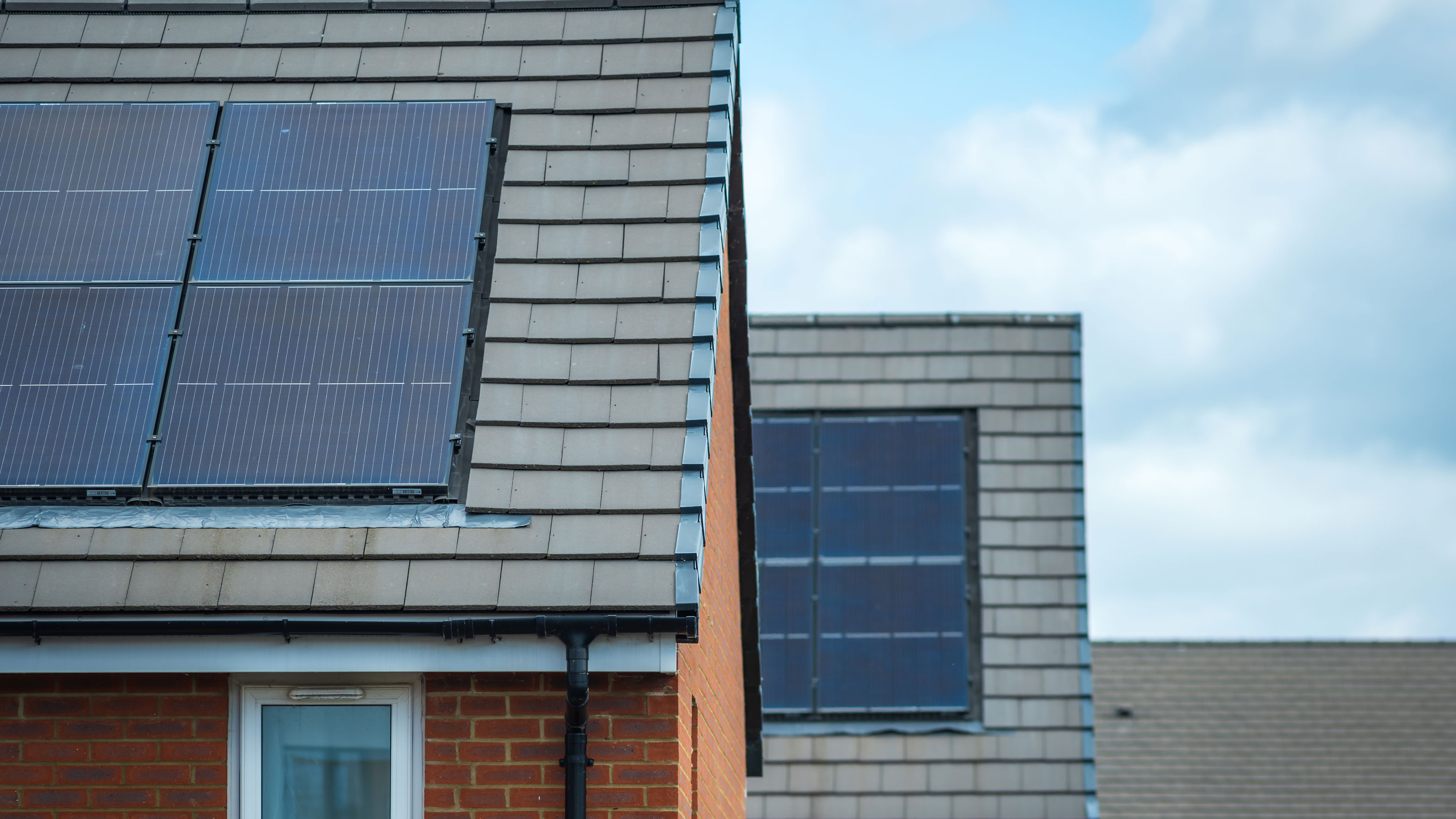 Solar panel on a grey sloping roof
