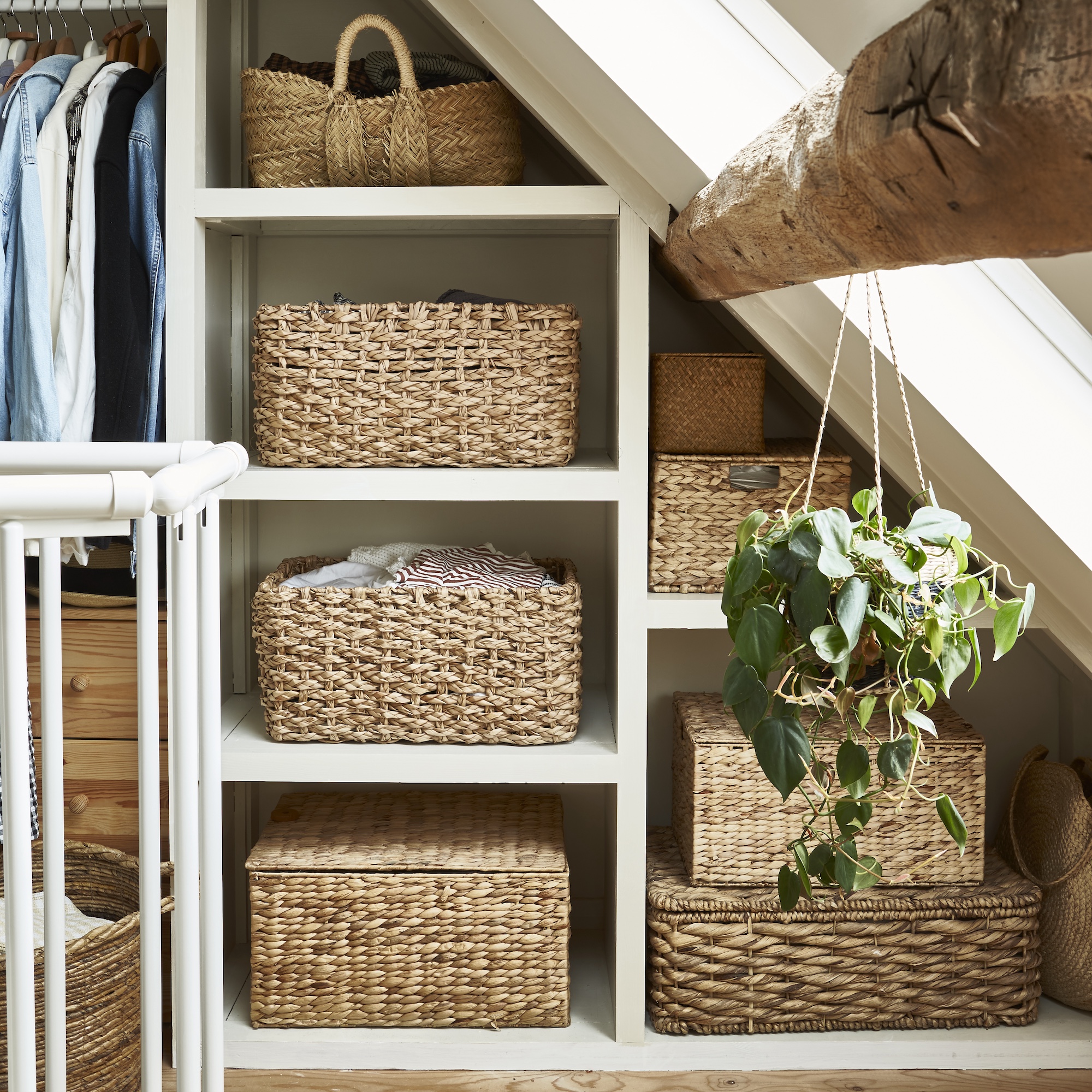 storage shelves with baskets beneath sloping eaves