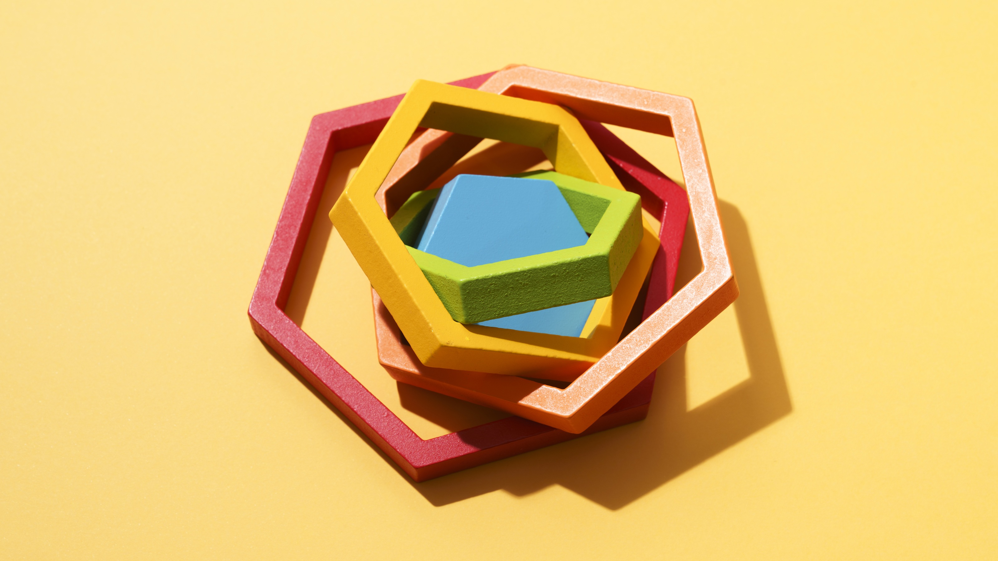 Multicolored puzzle blocks on top of each other but all askew.