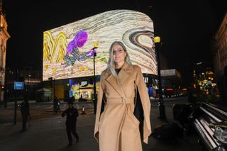 Artist Emma Talbot (wearing Max Mara) at the first screening for her CIRCA commission in Piccadilly Circus