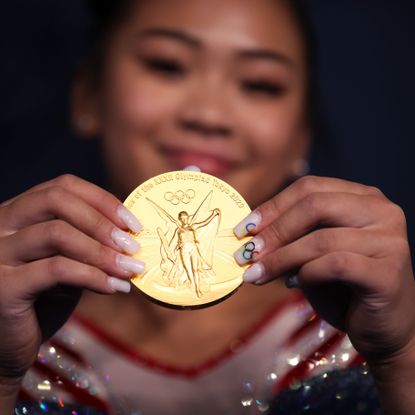 tokyo, japan july 29 sunisa lee of team united states poses with her gold medal after winning the womens all around final on day six of the tokyo 2020 olympic games at ariake gymnastics centre on july 29, 2021 in tokyo, japan photo by laurence griffithsgetty images