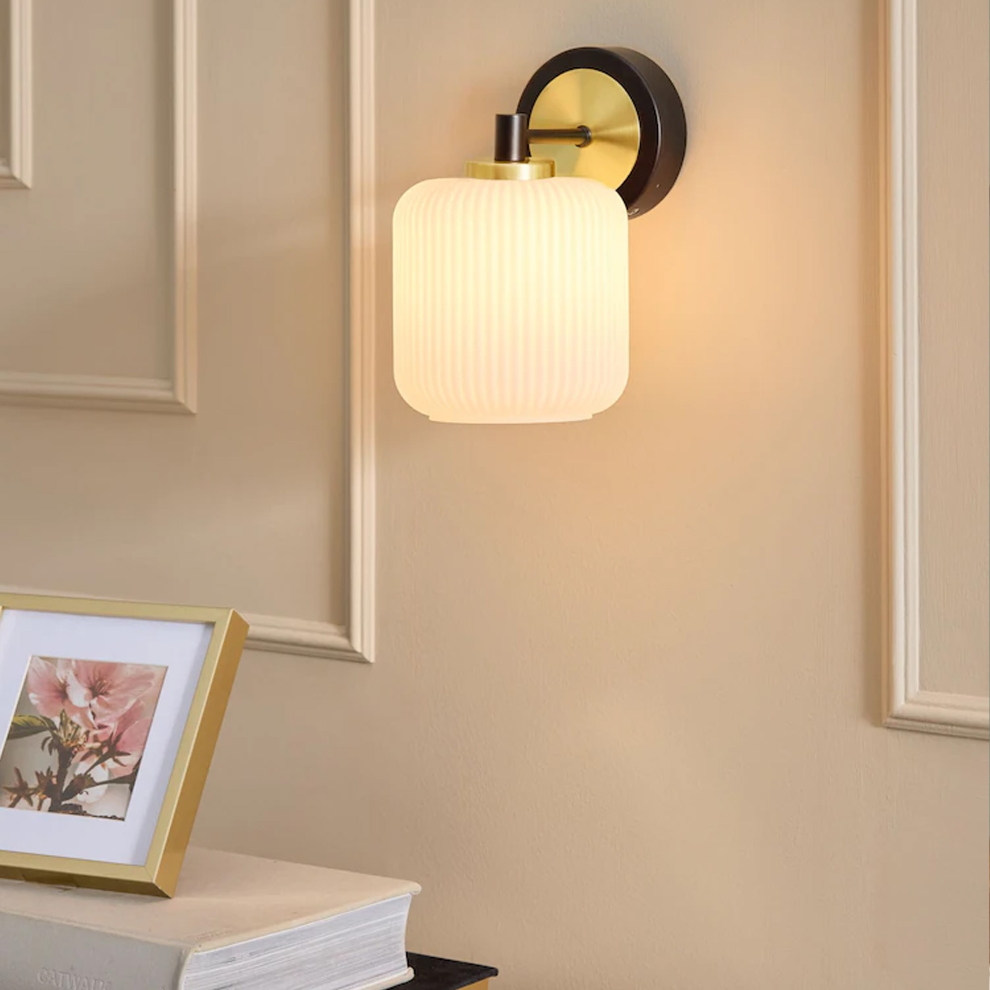 Next Black Ryker Rechargeable Wireless Wall Light at night