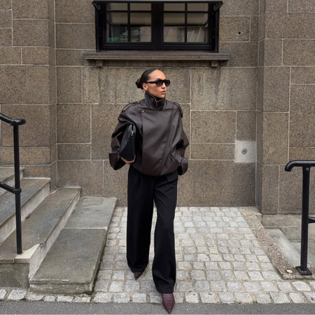 Influencer Ingrid Edvinsen wearing black trousers and brown shoes.