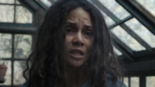 Halle Berry's mother character inside a greenhouse talking to her sons in Never Let Go