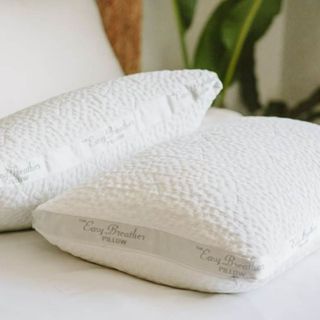 Nest Easy Breather Pillows on a bed.