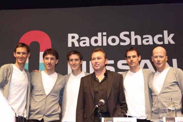 The RadioShack-Nissan team leaders flank Bruyneel
