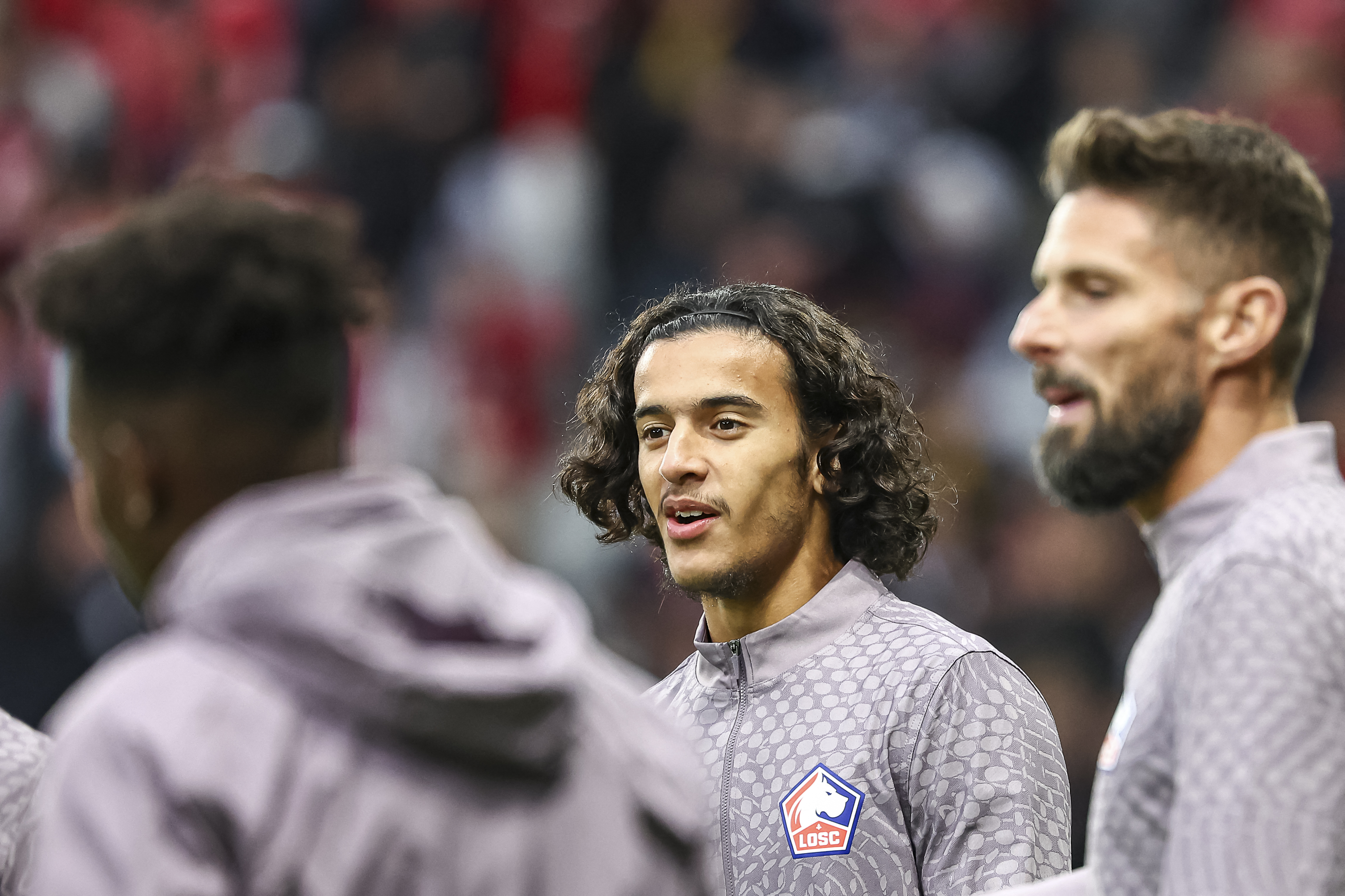Lille&#039;s French midfielder #32 Ayyoub Bouaddi (C) looks on as he warms up ahead of the UEFA Europa League 1st round day 1 football match between LOSC Lille and SK Brann at the Stade Pierre-Mauroy in Villeneuve-d&#039;Ascq, northern France, on September 25, 2025. (Photo by Sameer Al-DOUMY / AFP)