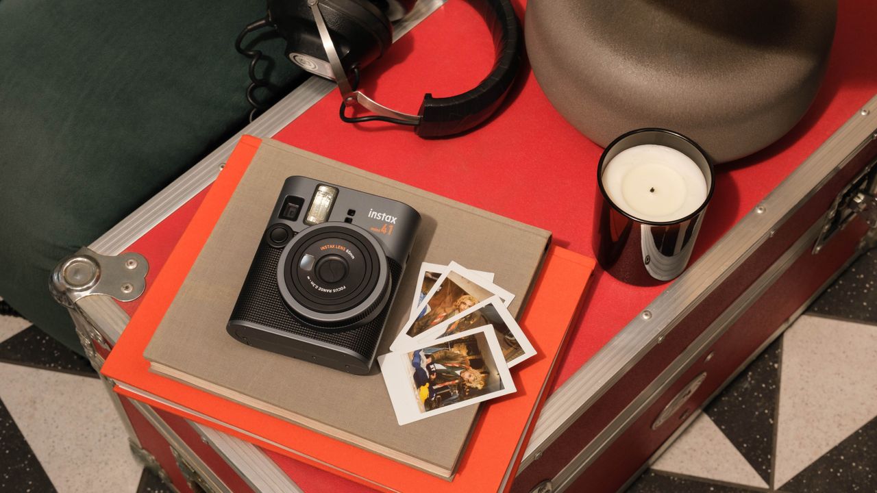 Fujifilm Instax Mini 41 in living room setting with printed photographs